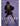 KREYA Nebula Crossbody bag styled on a  woman wearing a little black dress on a purple background